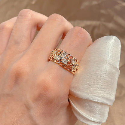 Kinel Damenring aus 585er Roségold mit natürlichem Zirkon im floralen Vintage-Design.